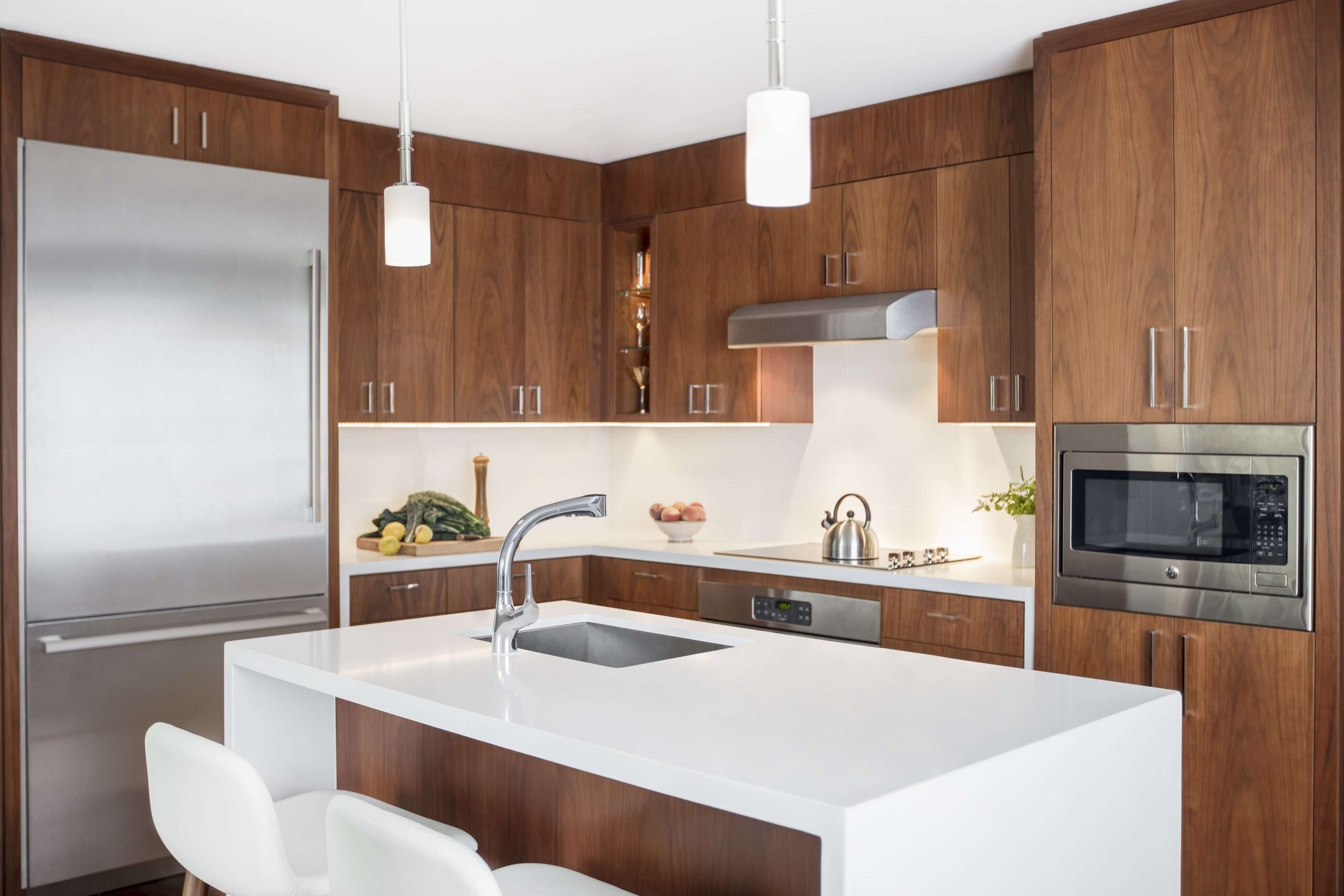 contemporary waterfall countertop, modern kitchen , contemporary kitchen , contemporary wood cabinetry , apartment design ,