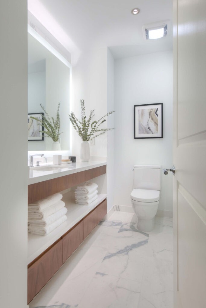 contemporary bathroom , luxury condo living , marble looking porcelain slab , custom bathroom cabinetry