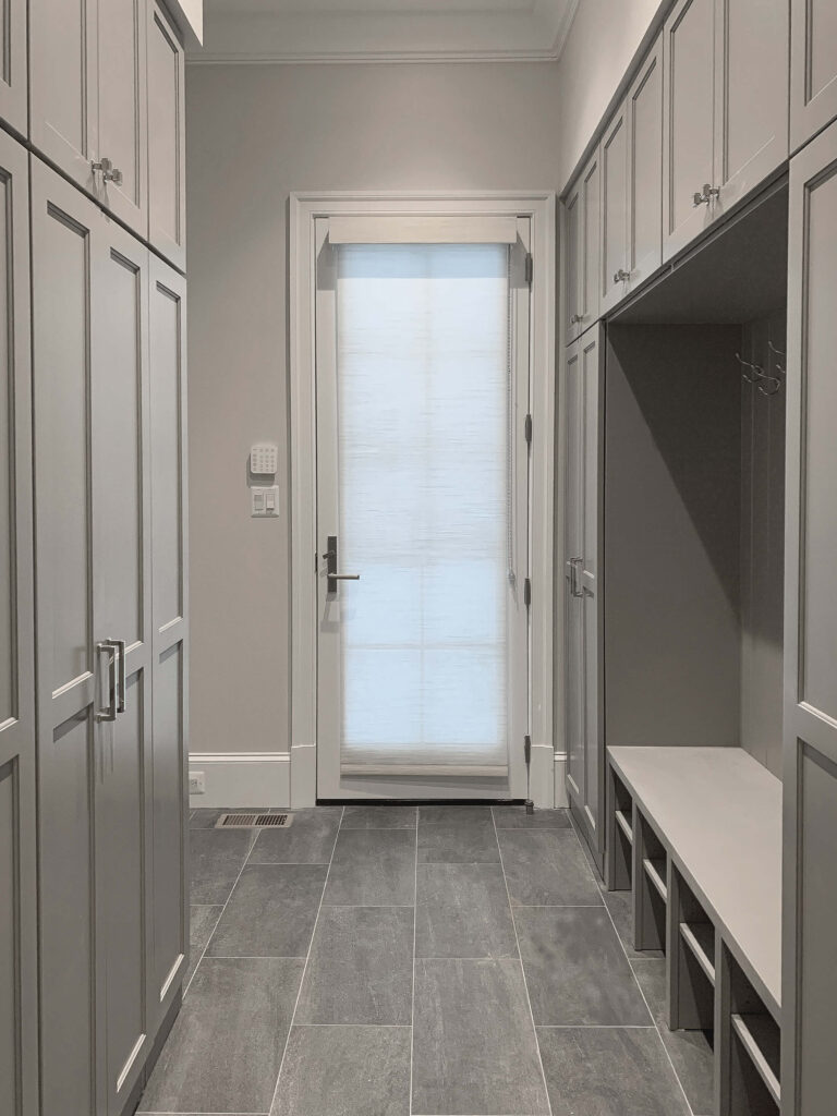 transitional mudroom, slate looking porcelain tile , contemporary custom home , luxury custom home