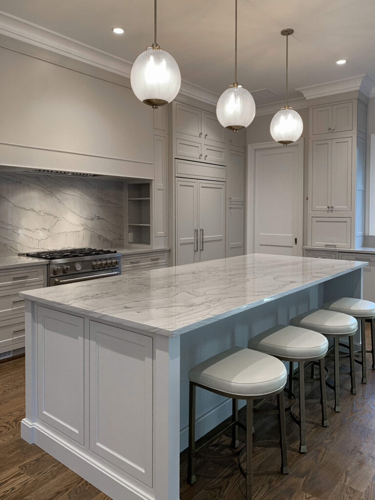 transitional kitchen, quartzite slab backsplash , inset cabinetry , luxury custom home