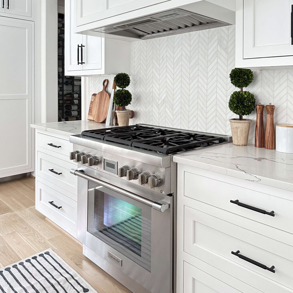 Transitional kitchen , custom home , shaker style inset cabinetry , chevron marble backsplash