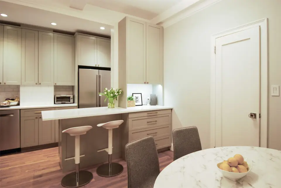 white quartz countertop, colored shaker cabinetry, transitional kitchen , white subway backsplash tile